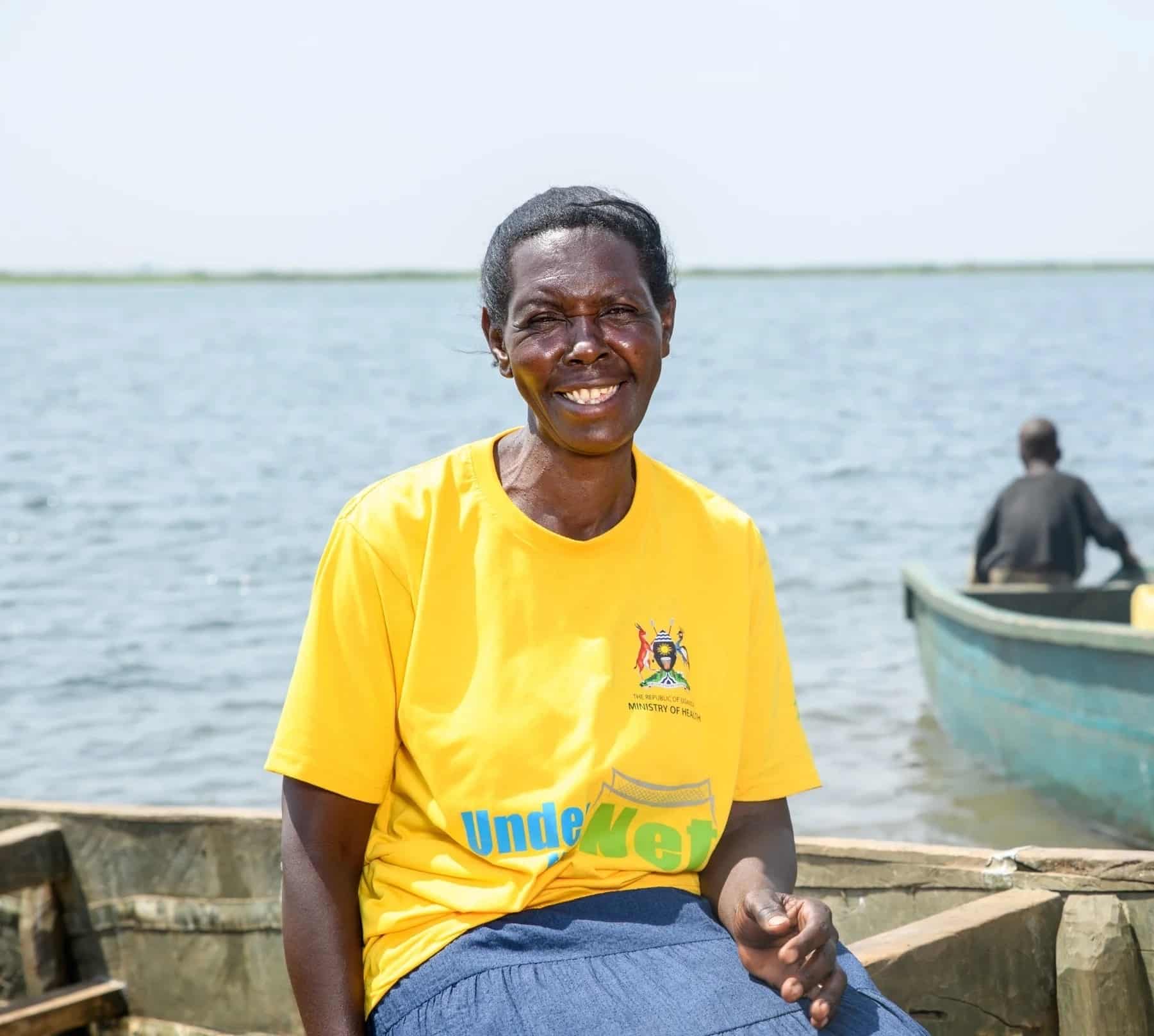Betty Babyerabira, sits on of the boats in Buwaiswa village, Kagumba, Kamuli district, Uganda.