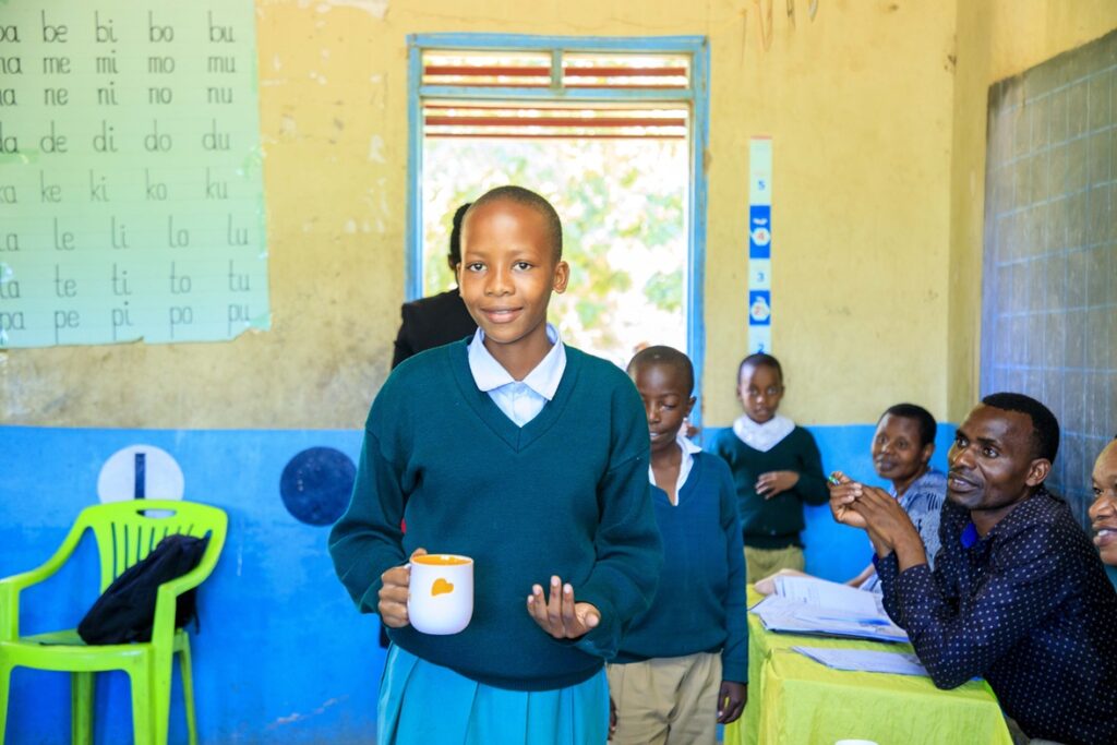 Anna Bayoba receives praziquantel during the mass drug distribution campaign by the ministry of health with support from Unlimit Health in Mwanza, Tanzania.